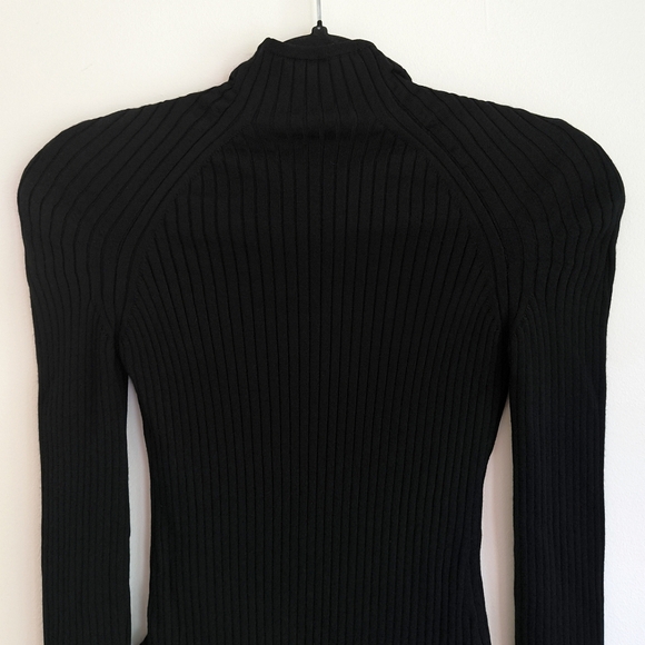 Alaia long sleeve wool blend ribbed knit bodysuit in black - Picture 6 of 12
